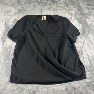 Black blouse‎ with a twist detail